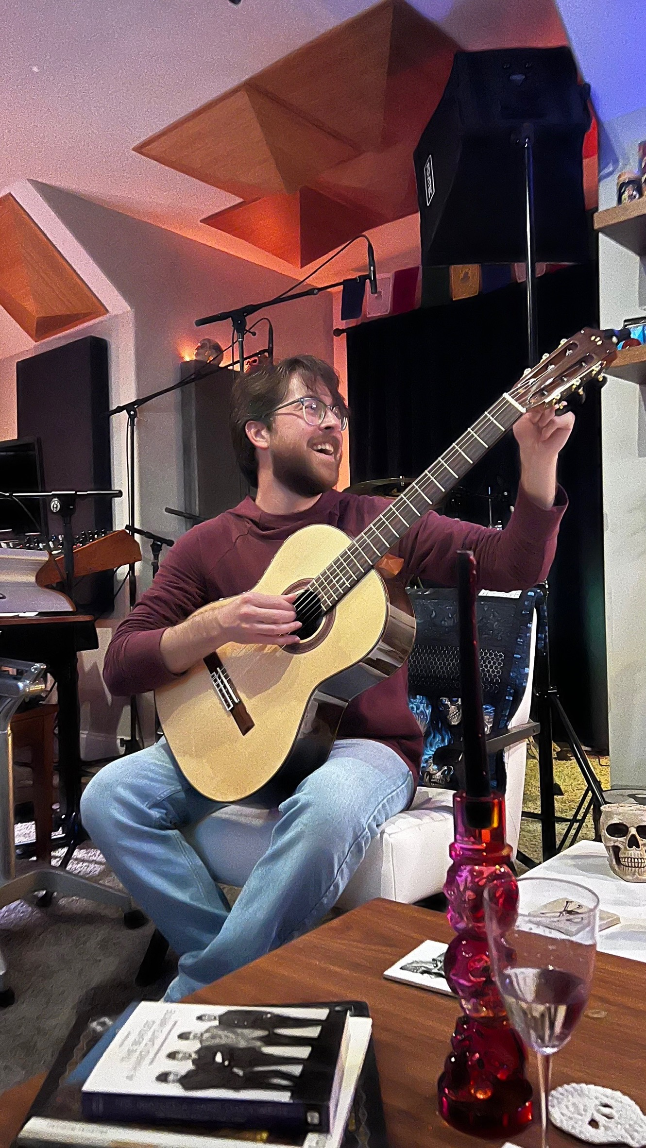 Smiling guitarist playing in Sweetflow Studio