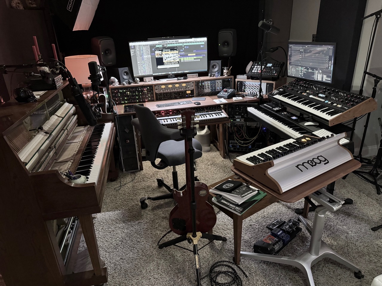 Full current Sweetflow Studio configuration with upright piano, recording desk, microphones, outboard equipment, synthesizers, guitar, and pedals