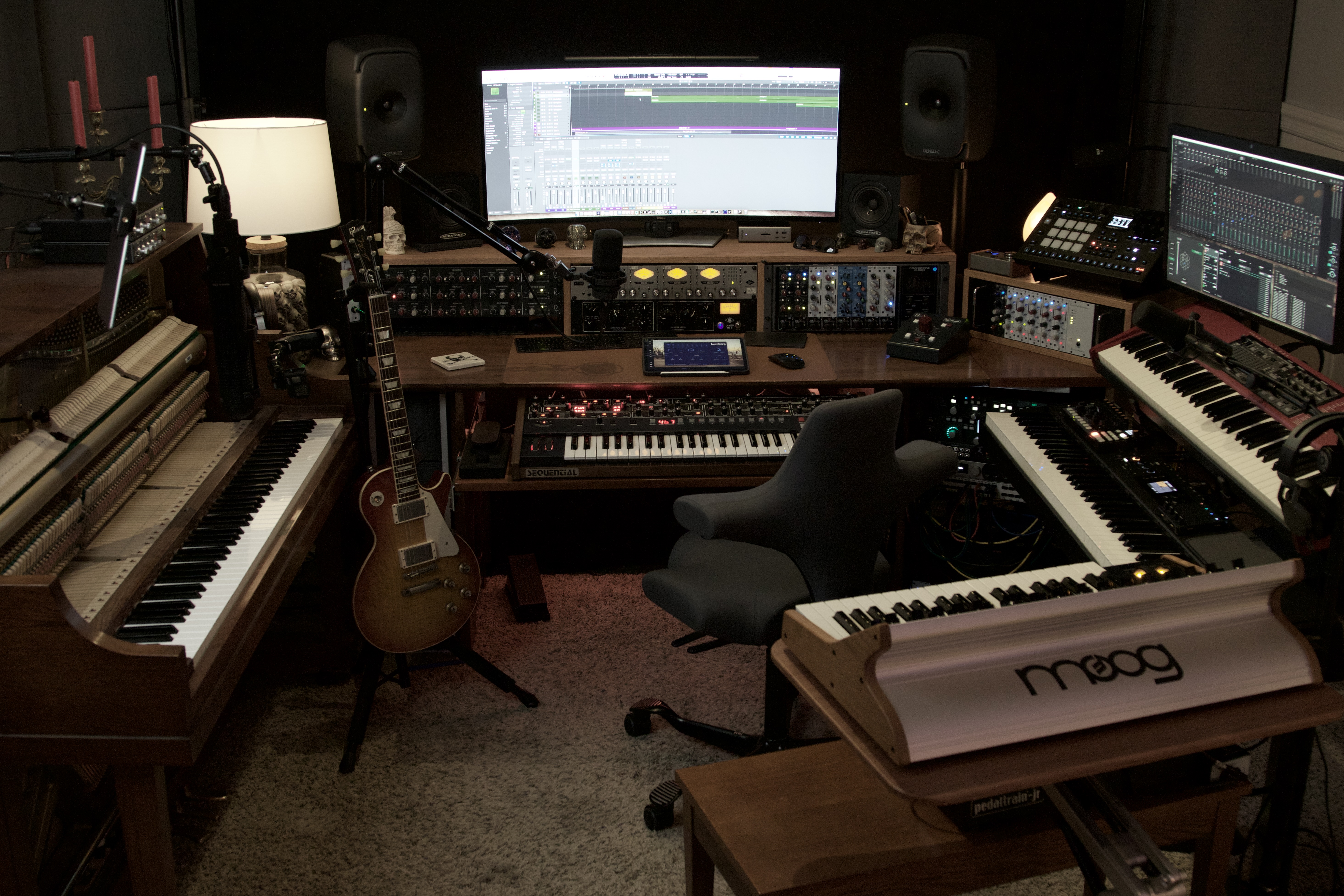 Sweetflow Studio control room with piano, synthesizers, guitars and recording equipment